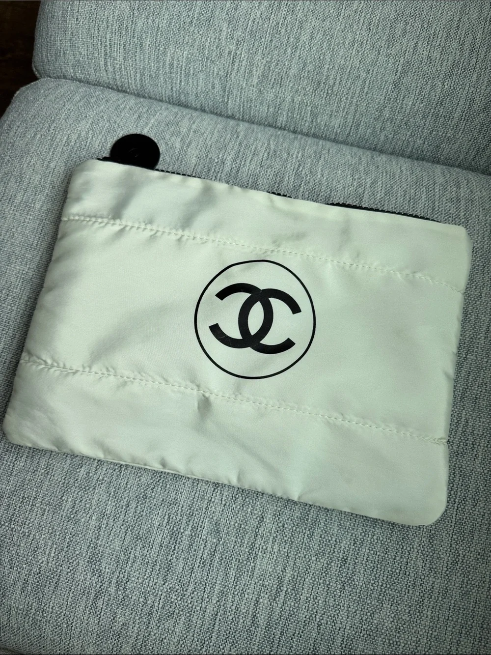 CHANEL Cream Quilted Pouch with Black Logo
